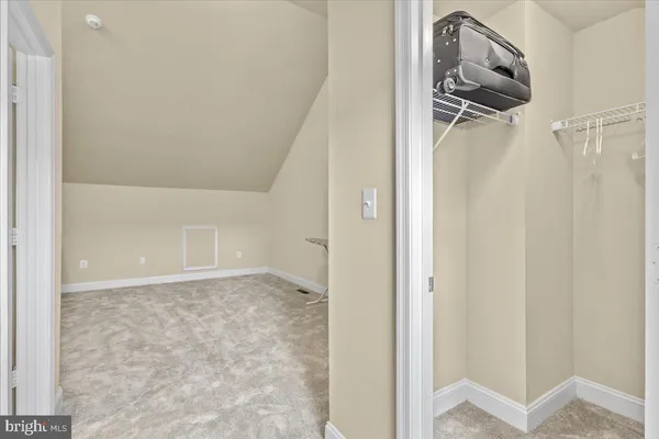 a view of a hallway with a white walls