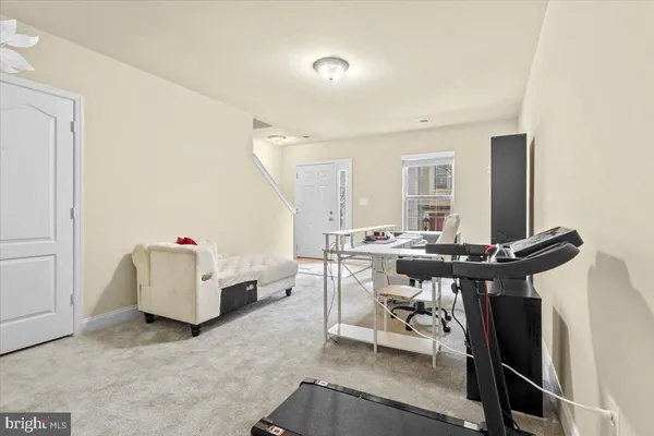a view of a livingroom with furniture and a window