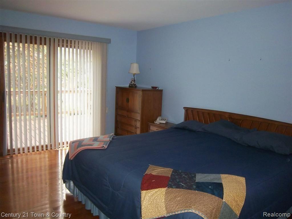 1092 Loncar Drive Rochester, MI 48307 - Photo 8 of 19 Master Bedroom with Doorwall to Deck