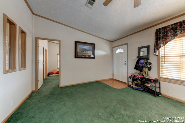 649 Rocky Hill Road Junction, TX 76849 - Photo 12 of 51 a room that has a bed and a window