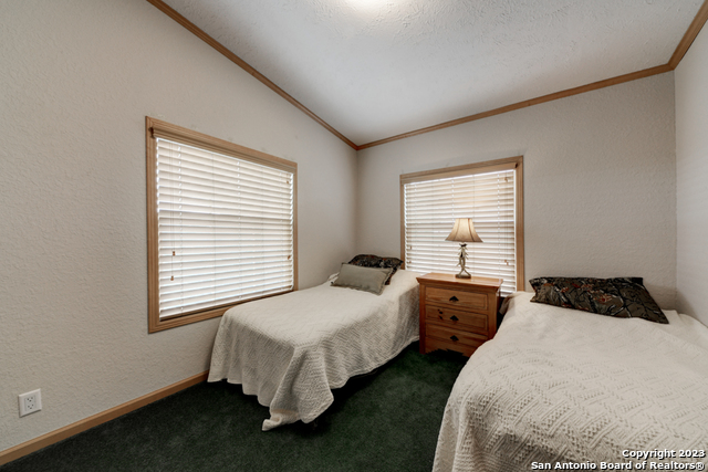 649 Rocky Hill Road Junction, TX 76849 - Photo 18 of 51 a bedroom with two beds and a window