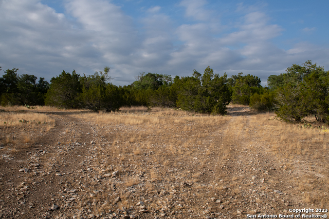 649 Rocky Hill Road Junction, TX 76849 - Photo 27 of 51 a view of a pathway with a building in the background