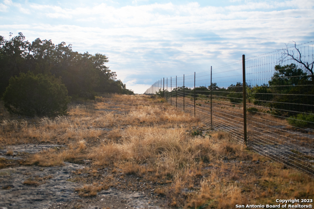 649 Rocky Hill Road Junction, TX 76849 - Photo 33 of 51 a view of a lake with a yard