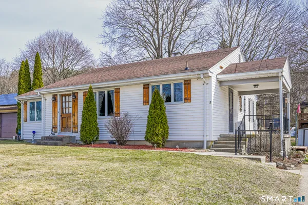 a view of house with yard