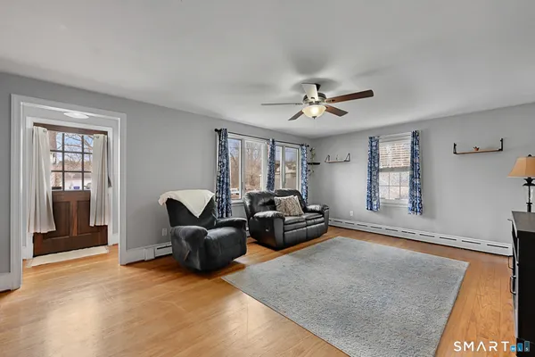 a living room with furniture and window