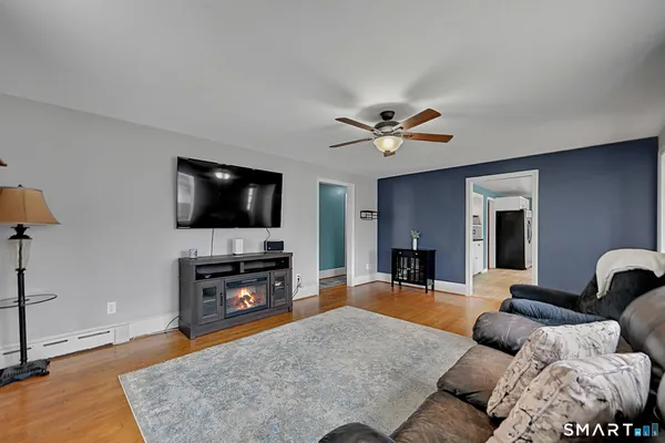 a living room with furniture and a flat screen tv