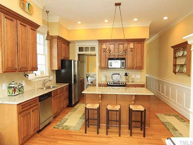 10323 Evergreen Spring Place Raleigh, NC 27614 - Photo 6 of 12 Kitchen features stainless appliances, granite countertops and adjoins butlers pantry. Kitchen