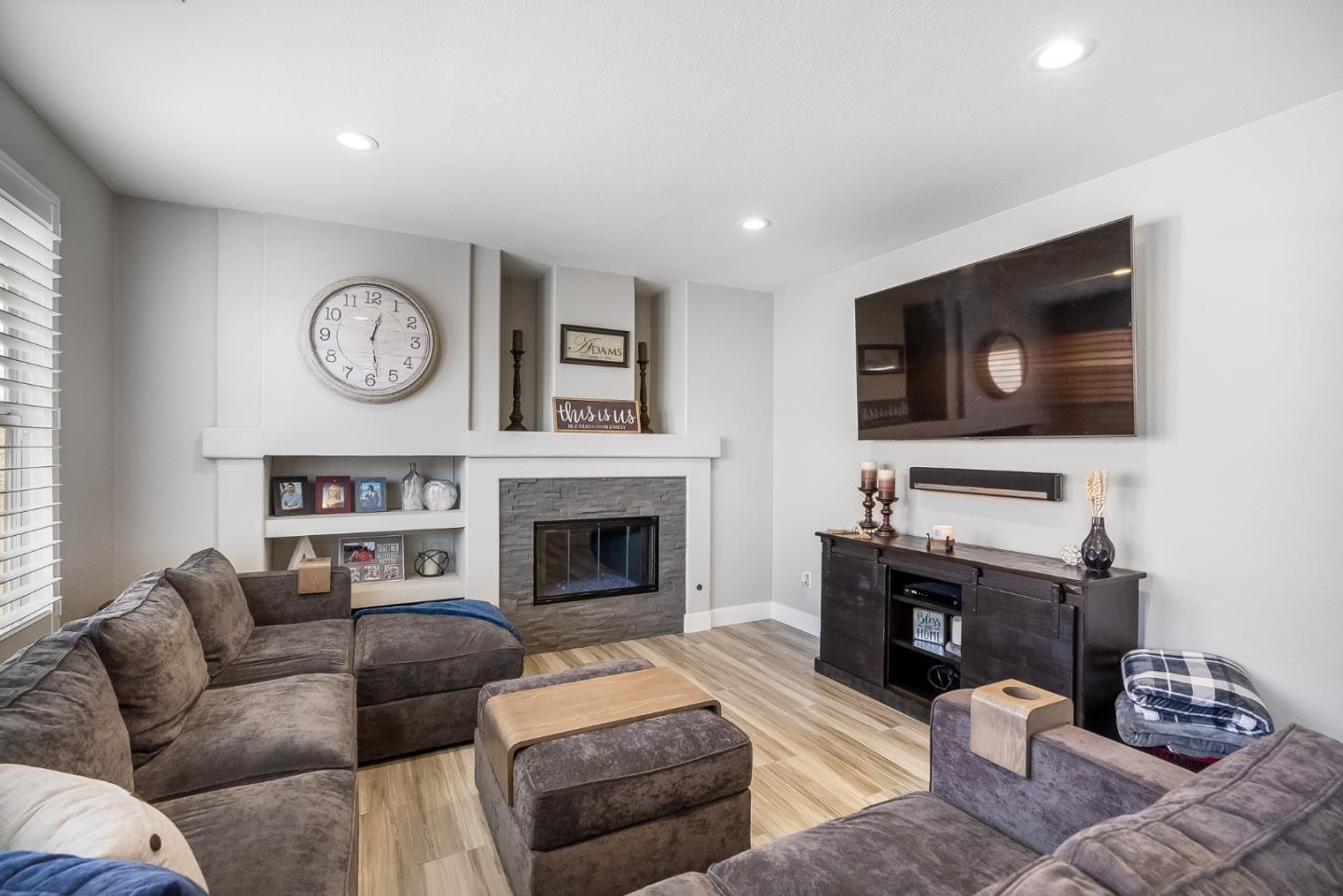 1170 Schoolhouse Road San Jose, CA 95138 - Photo 13 of 35 a living room with furniture a flat screen tv and a fireplace
