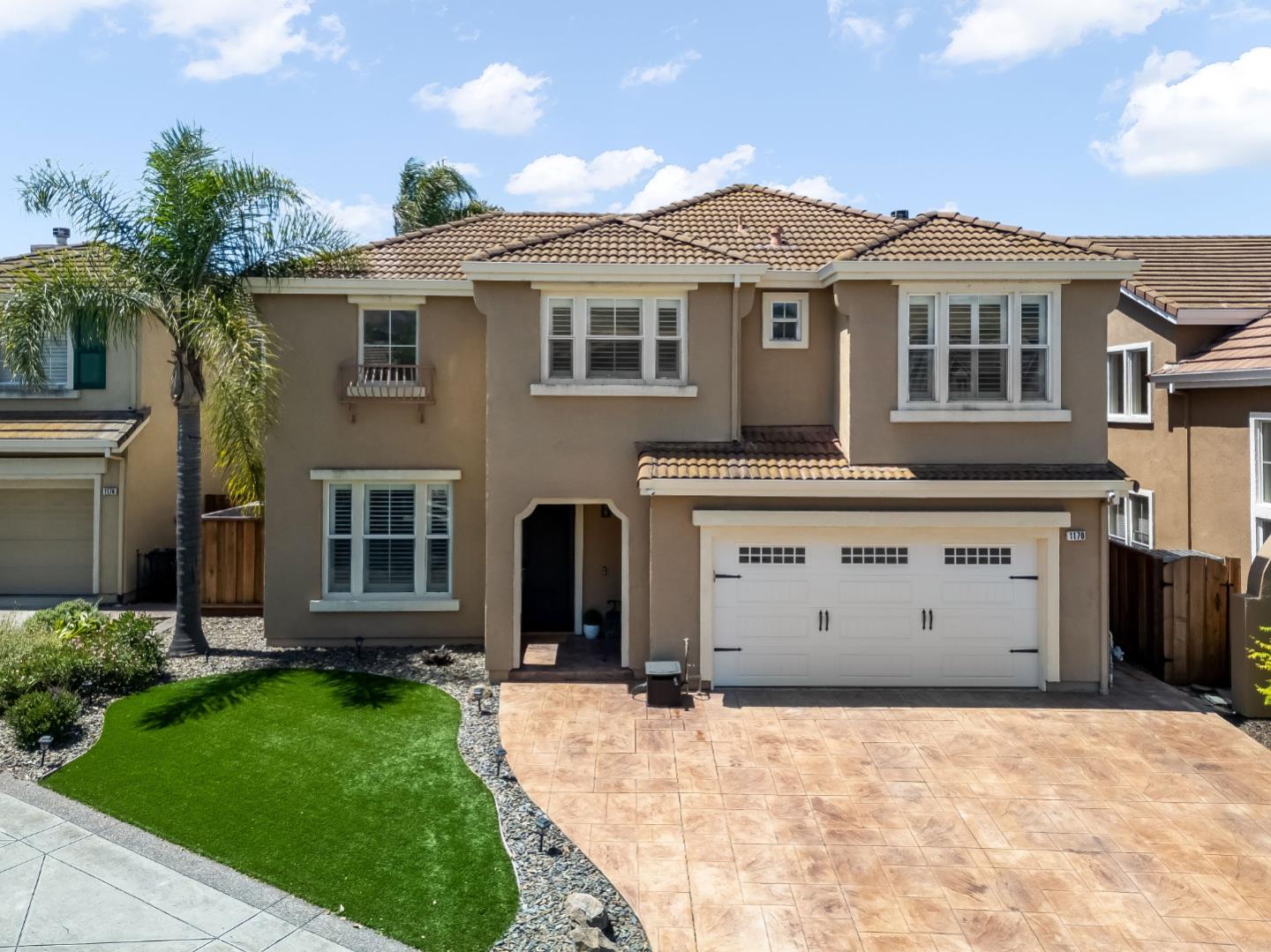1170 Schoolhouse Road San Jose, CA 95138 - Photo 2 of 35 a front view of a house with a yard