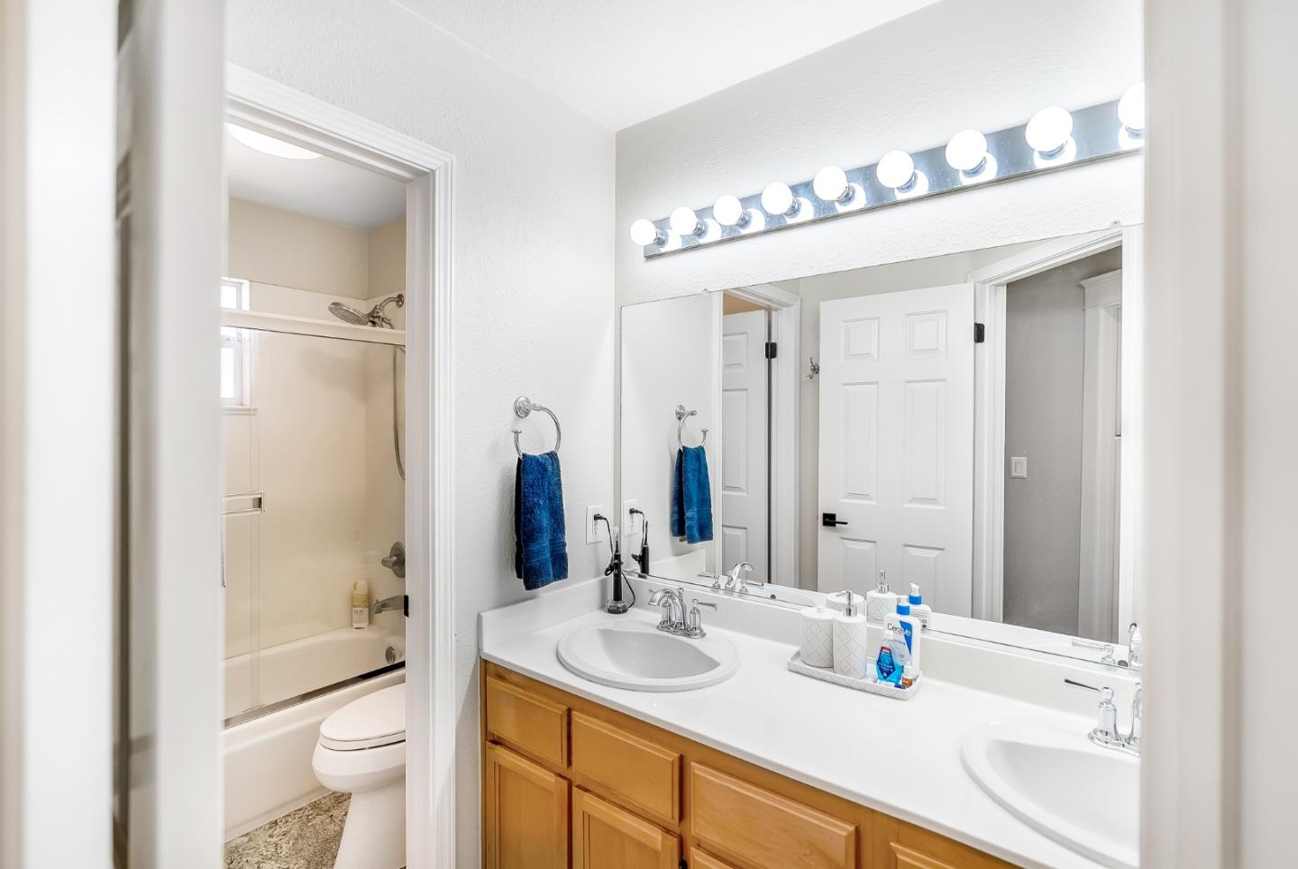 1170 Schoolhouse Road San Jose, CA 95138 - Photo 25 of 35 a bathroom with a sink a toilet and a mirror