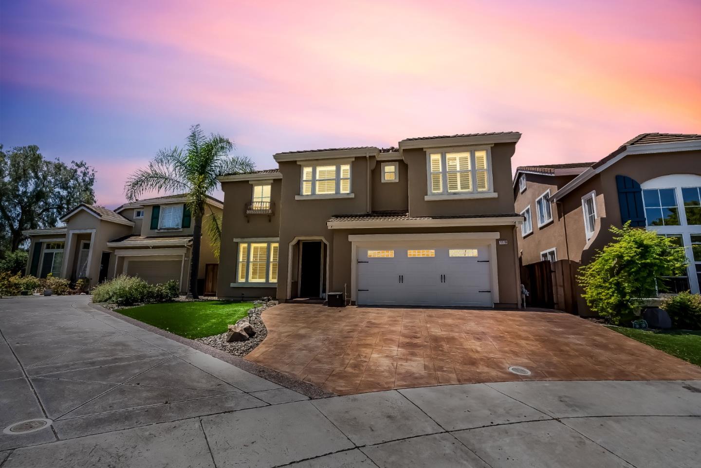 1170 Schoolhouse Road San Jose, CA 95138 - Photo 3 of 35 a front view of a house with a yard and garage