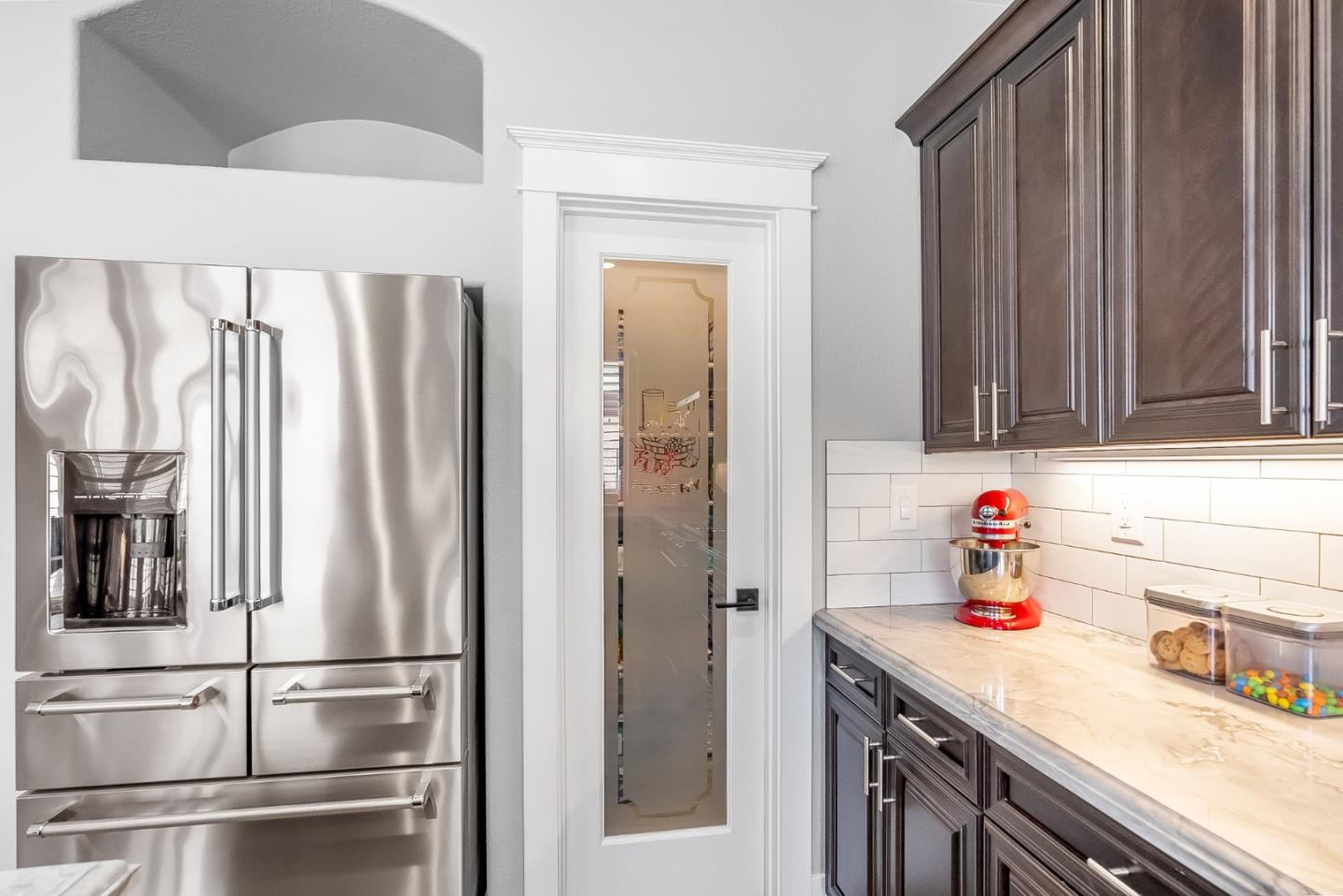 1170 Schoolhouse Road San Jose, CA 95138 - Photo 8 of 35 a kitchen with a refrigerator and cabinets