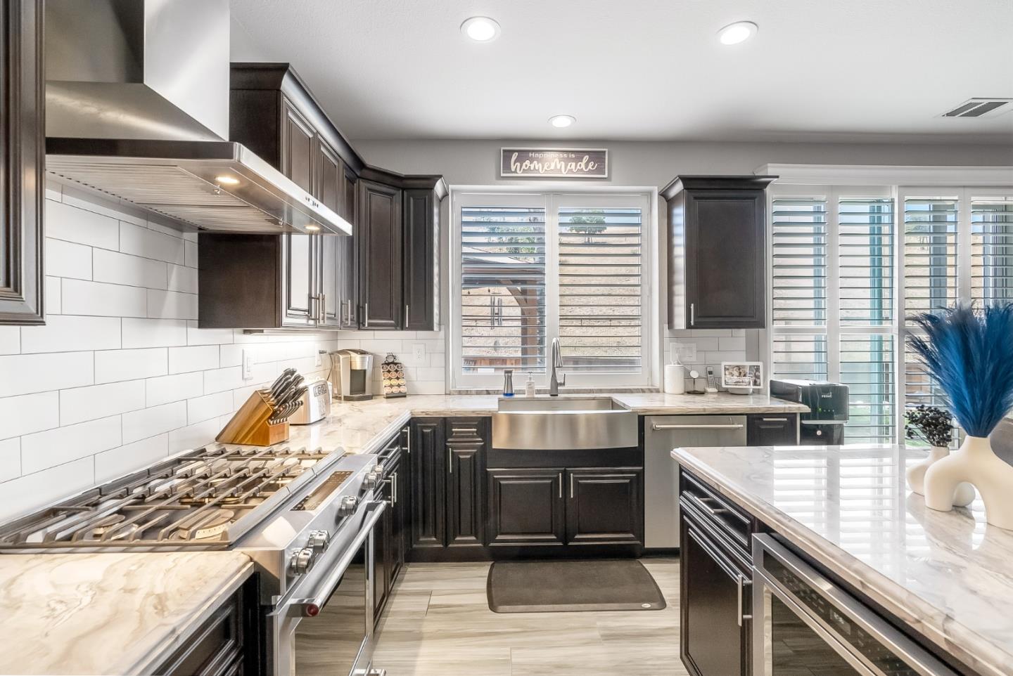 1170 Schoolhouse Road San Jose, CA 95138 - Photo 9 of 35 a kitchen with stainless steel appliances granite countertop a sink and a stove