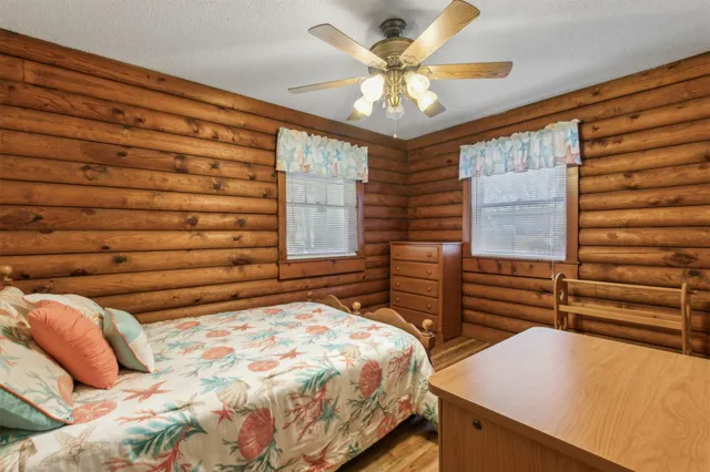 a living room with furniture and a dresser