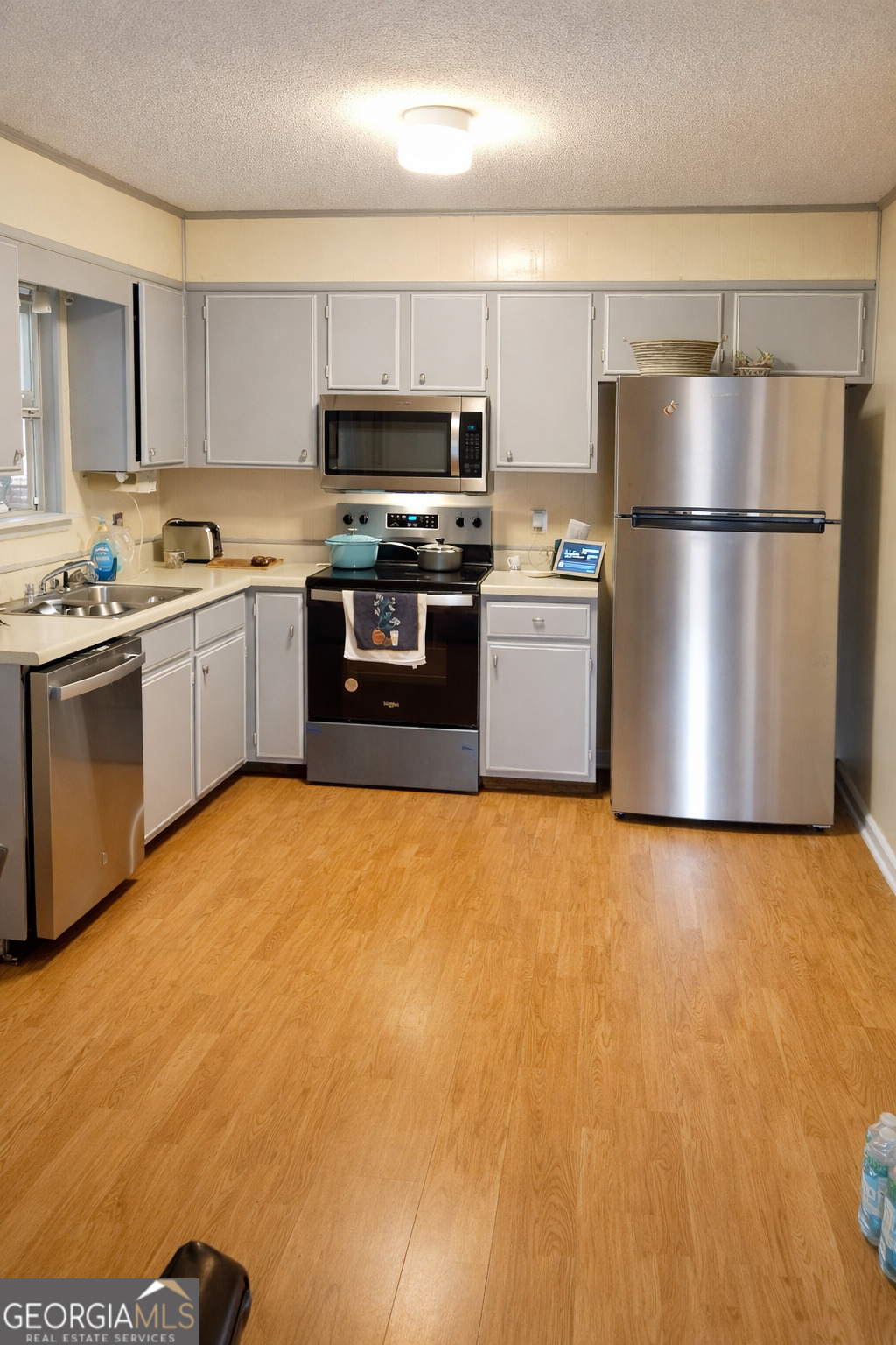 1626 Pine Street Northeast Edison, GA 39846 - Photo 3 of 10 a kitchen with stainless steel appliances granite countertop a refrigerator sink and stove