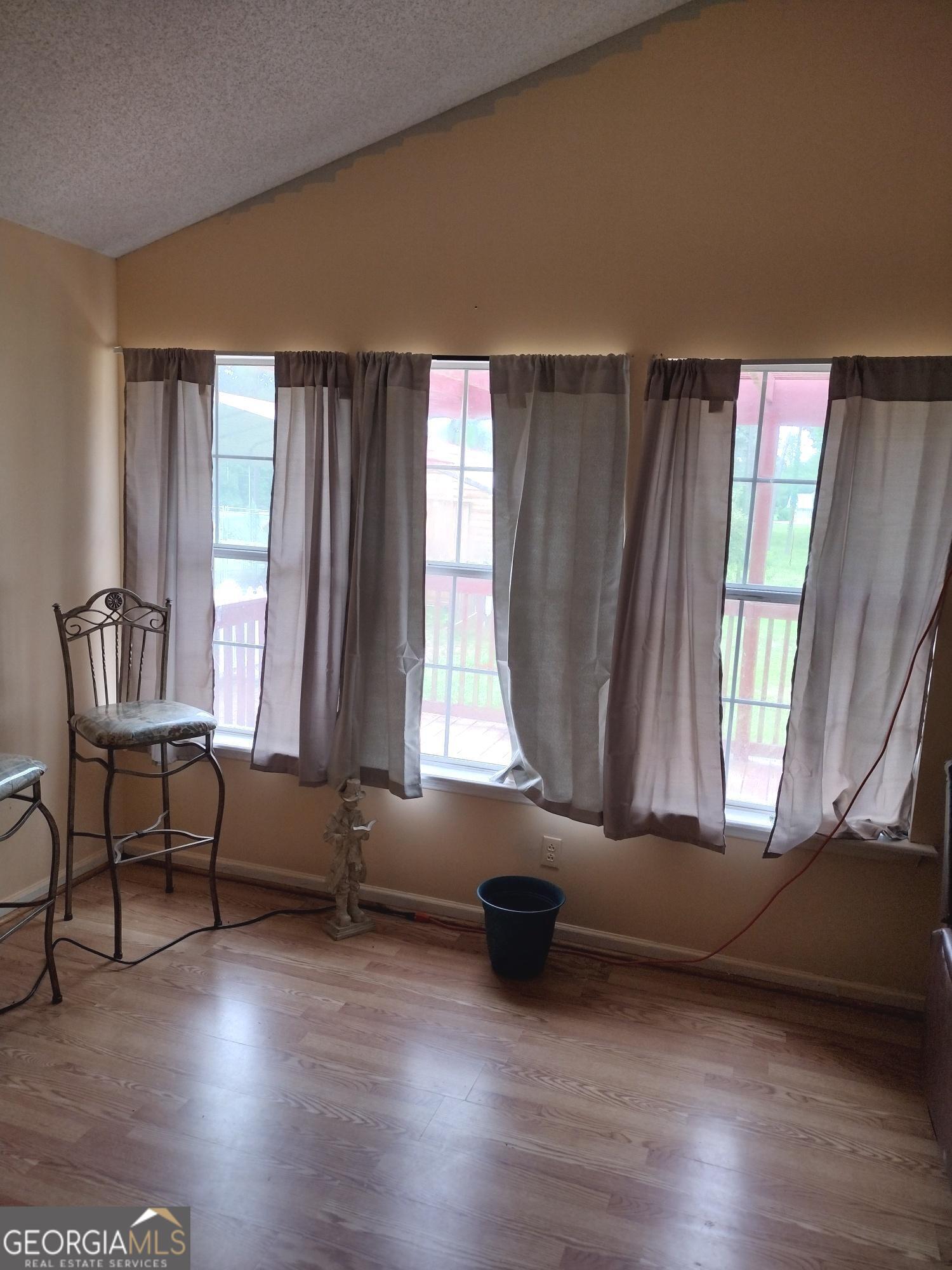 1626 Pine Street Northeast Edison, GA 39846 - Photo 6 of 10 a living room with furniture and a window