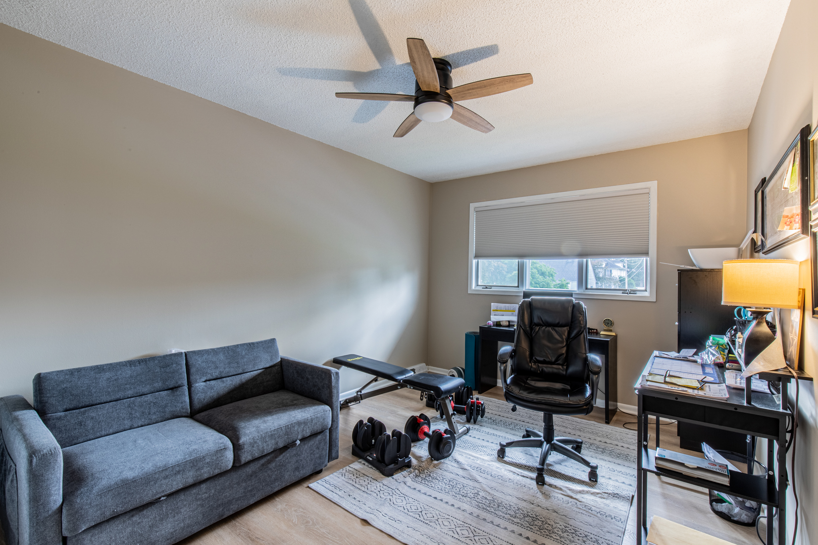 973 Innsbruck Lane, Unit 4G Princeton, IL 61356 - Photo 14 of 15 a livingroom with workspace and a couch