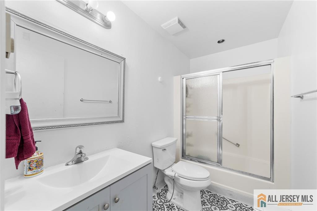 25C Pitman Road, Unit B Monroe Township, NJ 08831 - Photo 17 of 29 a bathroom with a sink toilet and shower