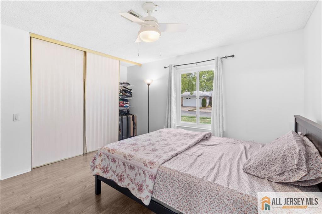 25C Pitman Road, Unit B Monroe Township, NJ 08831 - Photo 21 of 29 a bedroom with a large bed and a window