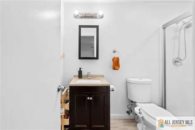 a bathroom with a shower and toilet