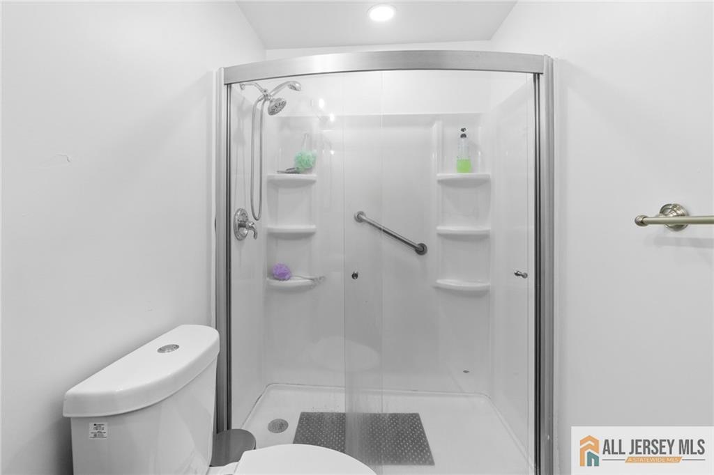 25C Pitman Road, Unit B Monroe Township, NJ 08831 - Photo 23 of 29 a bathroom with a shower and toilet