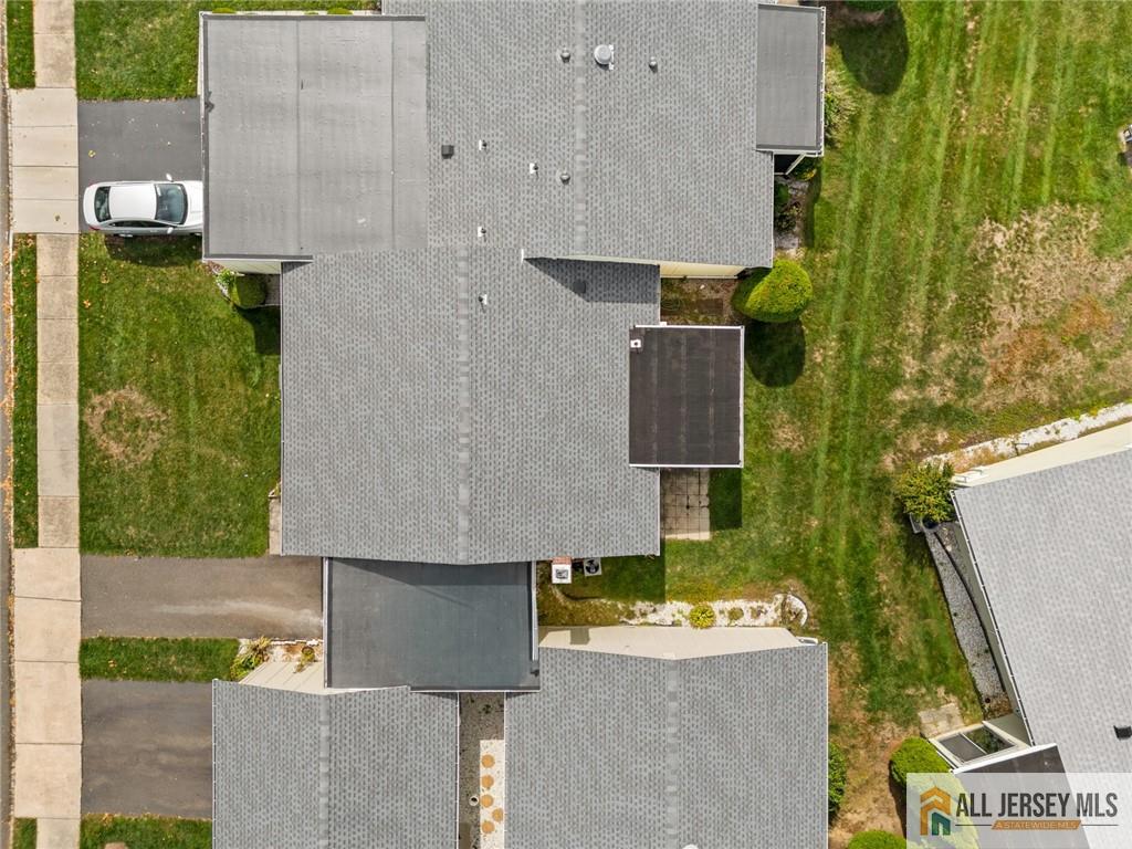 25C Pitman Road, Unit B Monroe Township, NJ 08831 - Photo 27 of 29 an aerial view of a house with a yard and large tree