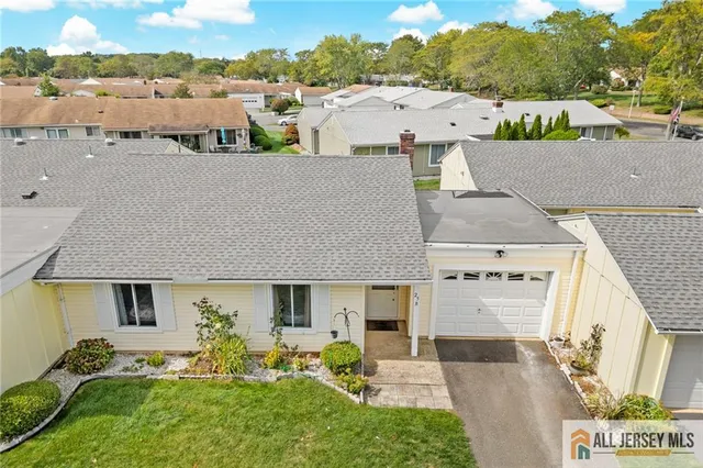 a view of house with outdoor space and sitting area