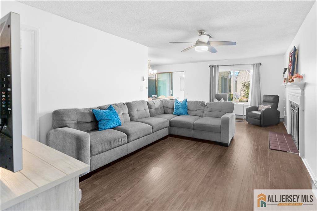25C Pitman Road, Unit B Monroe Township, NJ 08831 - Photo 5 of 29 a living room with furniture and a large window