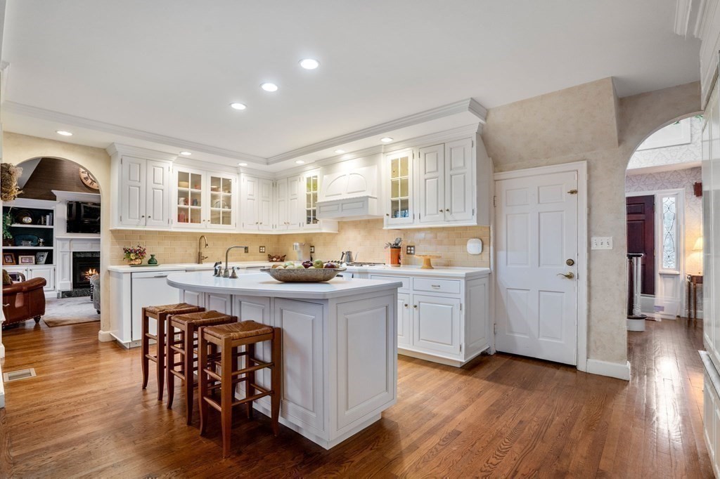 37 Boulder Road Wellesley, MA 02481 - Photo 13 of 42 a kitchen with stainless steel appliances granite countertop wooden floors and white cabinets