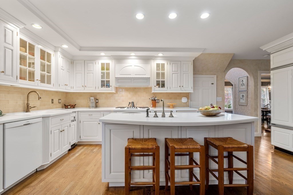 37 Boulder Road Wellesley, MA 02481 - Photo 14 of 42 a kitchen with granite countertop white cabinets and chairs