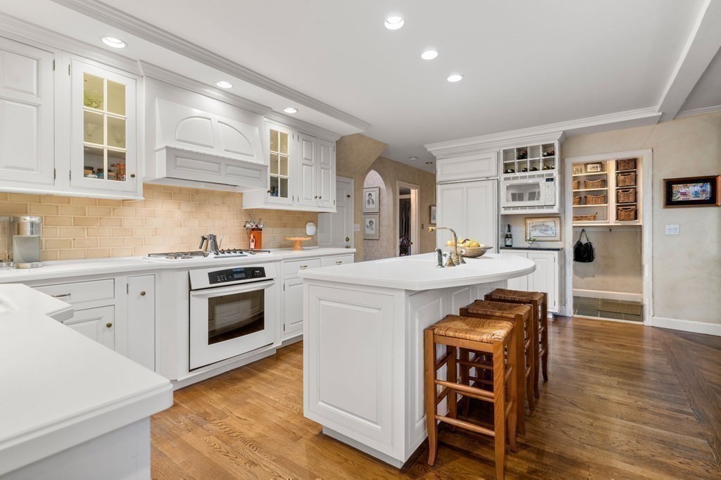 37 Boulder Road Wellesley, MA 02481 - Photo 16 of 42 a kitchen with a stove a sink and a refrigerator