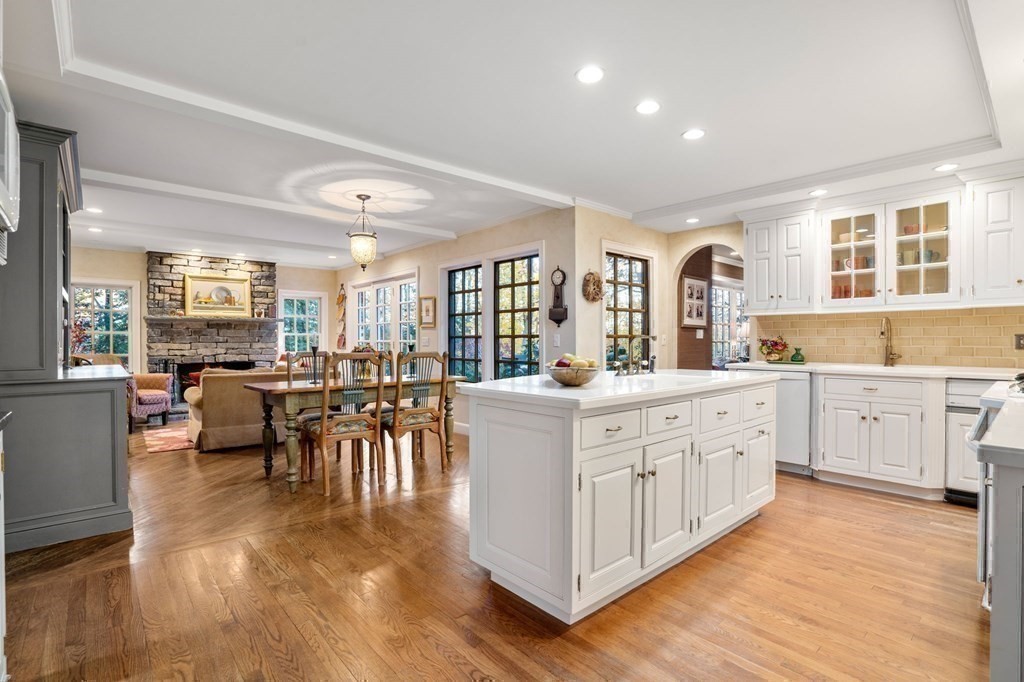 37 Boulder Road Wellesley, MA 02481 - Photo 17 of 42 a large white dining hall with stainless steel appliances granite countertop a large counter top and a stove
