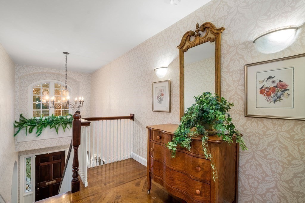 37 Boulder Road Wellesley, MA 02481 - Photo 24 of 42 a living room with furniture and a chandelier