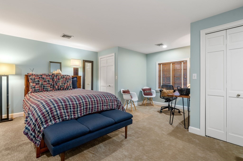 37 Boulder Road Wellesley, MA 02481 - Photo 32 of 42 a bedroom with a bed couch and a window