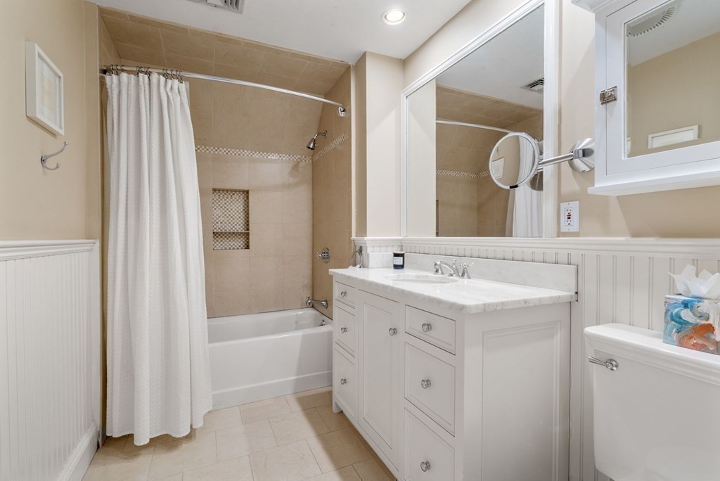 37 Boulder Road Wellesley, MA 02481 - Photo 33 of 42 a bathroom with a tub sink and mirror