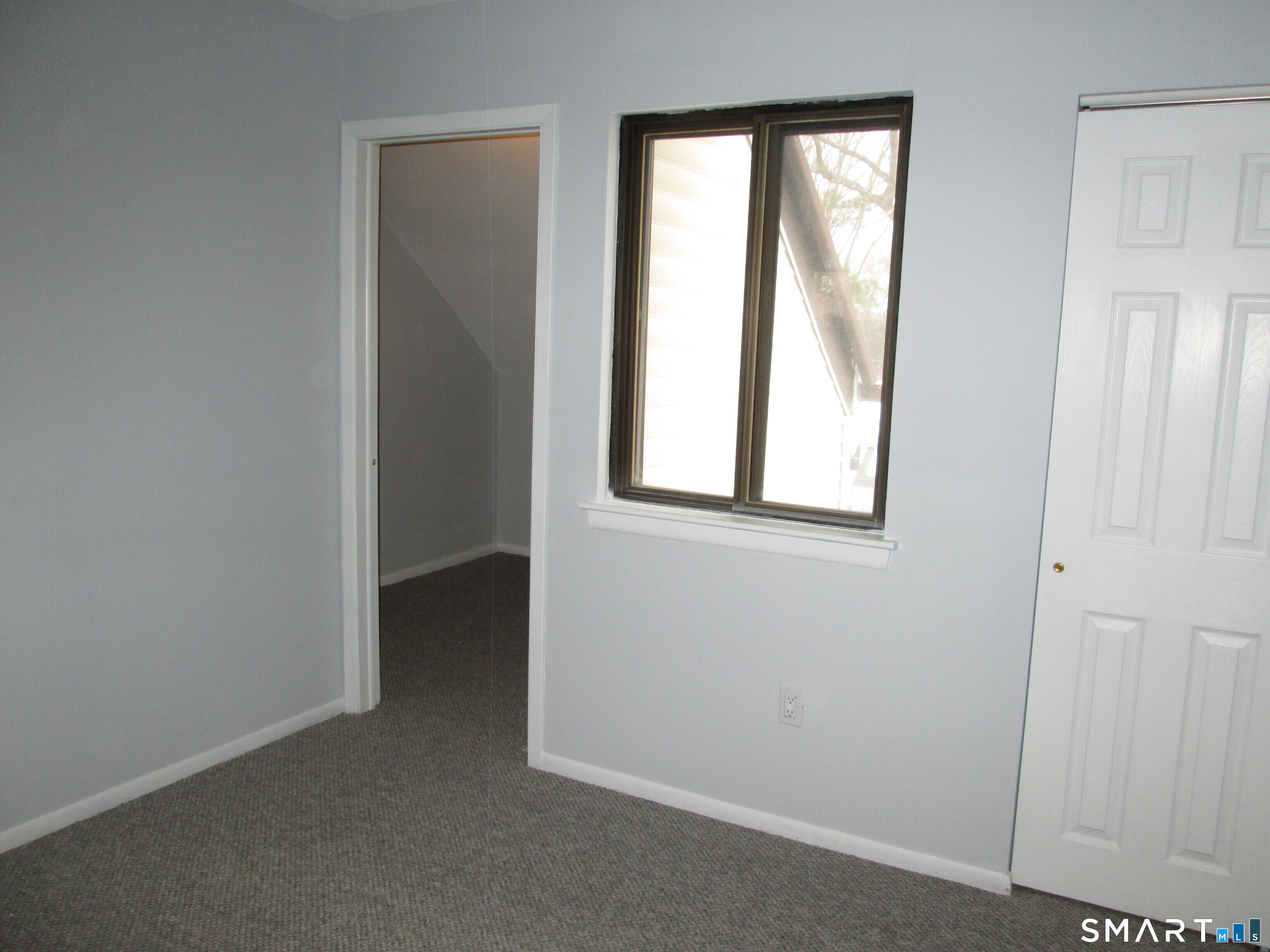 285 Queen Street, Unit 4F Southington, CT 06489 - Photo 15 of 22 an empty room with windows and closet