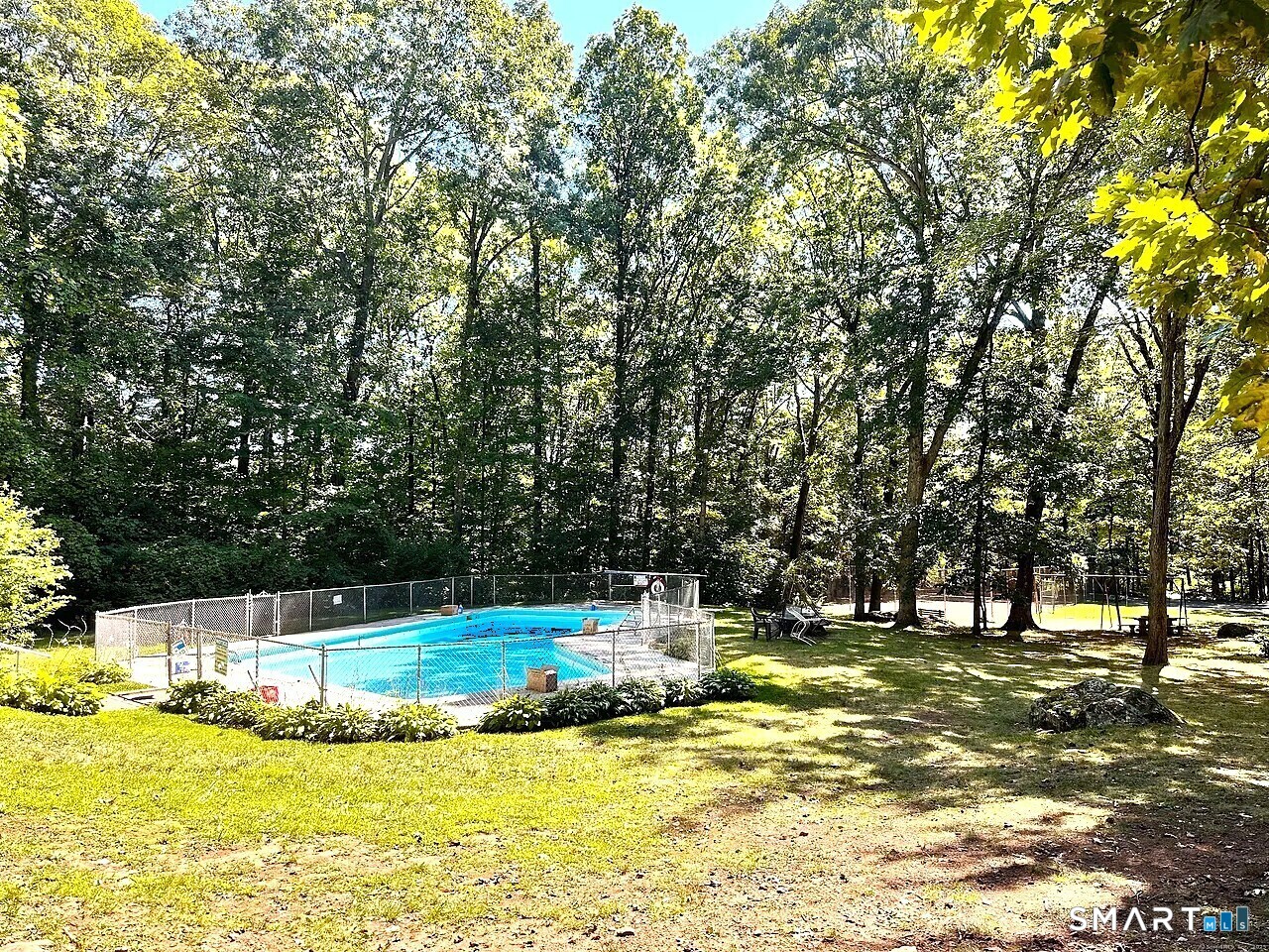 285 Queen Street, Unit 4F Southington, CT 06489 - Photo 4 of 22 a view of swimming pool with trees