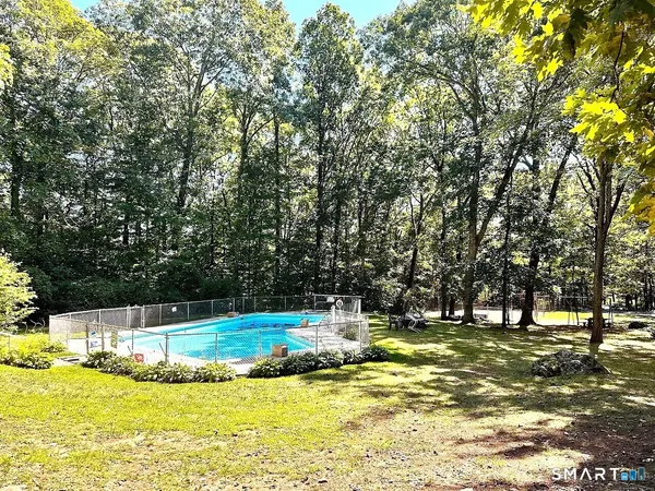a view of swimming pool with trees