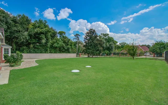 a view of a golf course with a lake