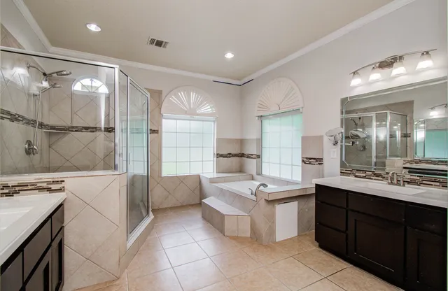 a view of a big room with wooden floor and a kitchen