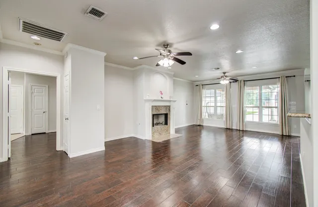 a kitchen with stainless steel appliances granite countertop a stove top oven and sink