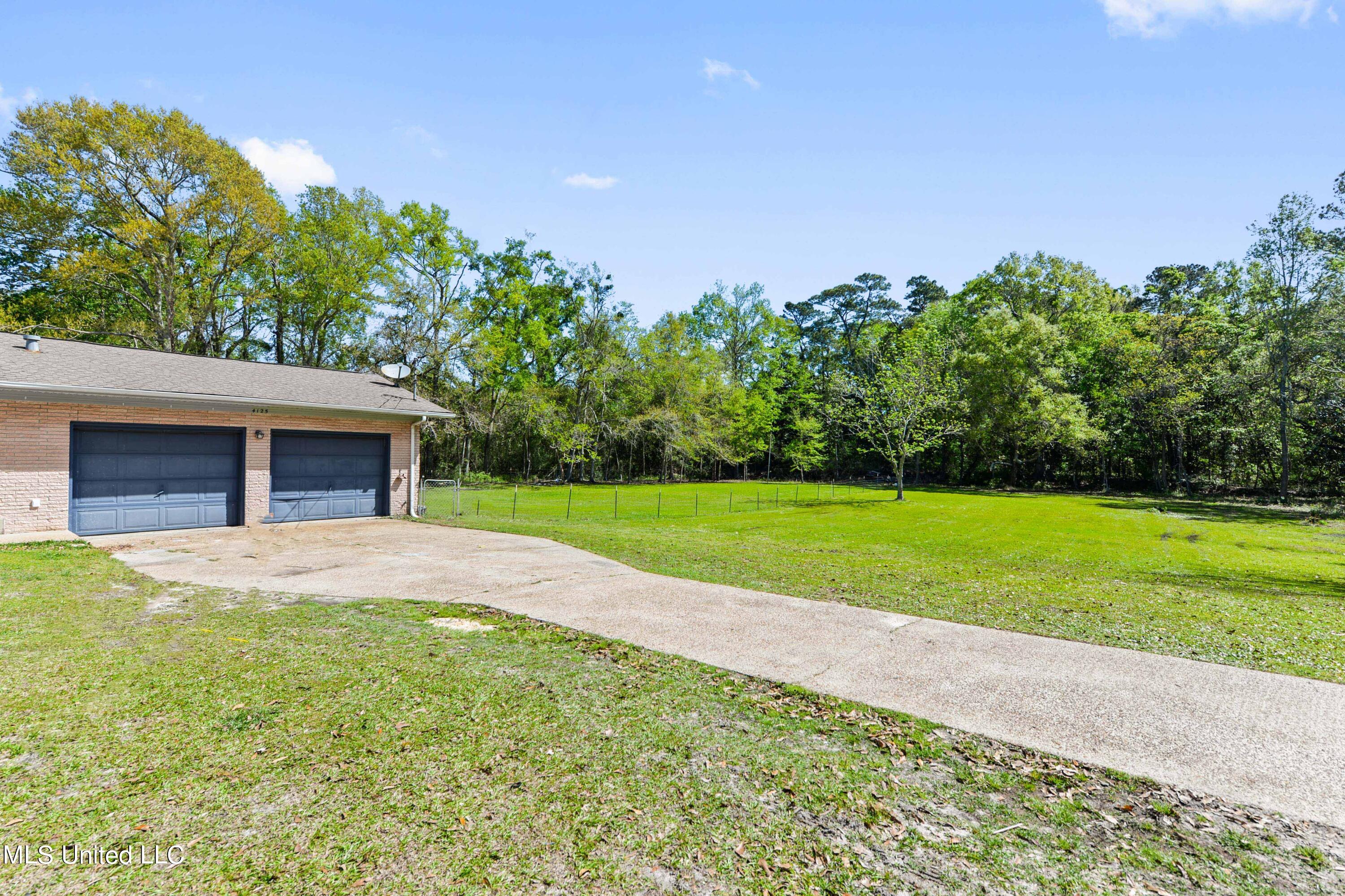 4125 Del Rosa Avenue Moss Point, MS 39563 - Photo 2 of 33 Large 2 Car Garage with long driveway