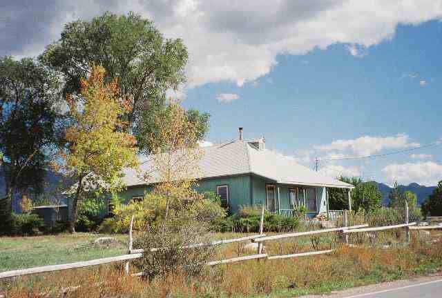 4269 233rd Road Rifle, CO 81650 - Photo 1 of 5 front view of a house with a yard