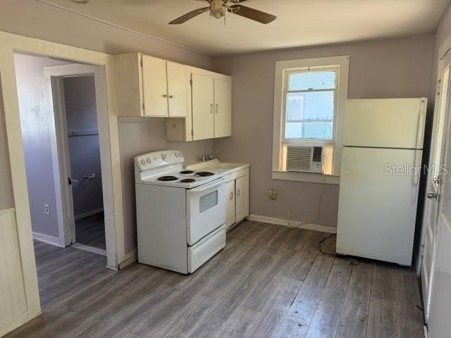 6921 Washington Street, Unit 4 New Port Richey, FL 34652 - Photo 2 of 5 a view of kitchen and wooden floor
