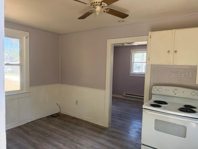6921 Washington Street, Unit 4 New Port Richey, FL 34652 - Photo 3 of 5 a view of kitchen and hallway with wooden floor
