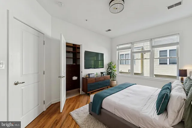 a bedroom with a bed and a couch