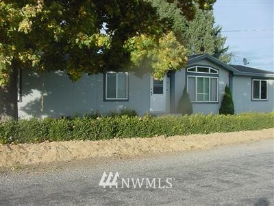 121 Pogue Road Omak, WA 98841 - Photo 1 of 1 front view of house next to a road
