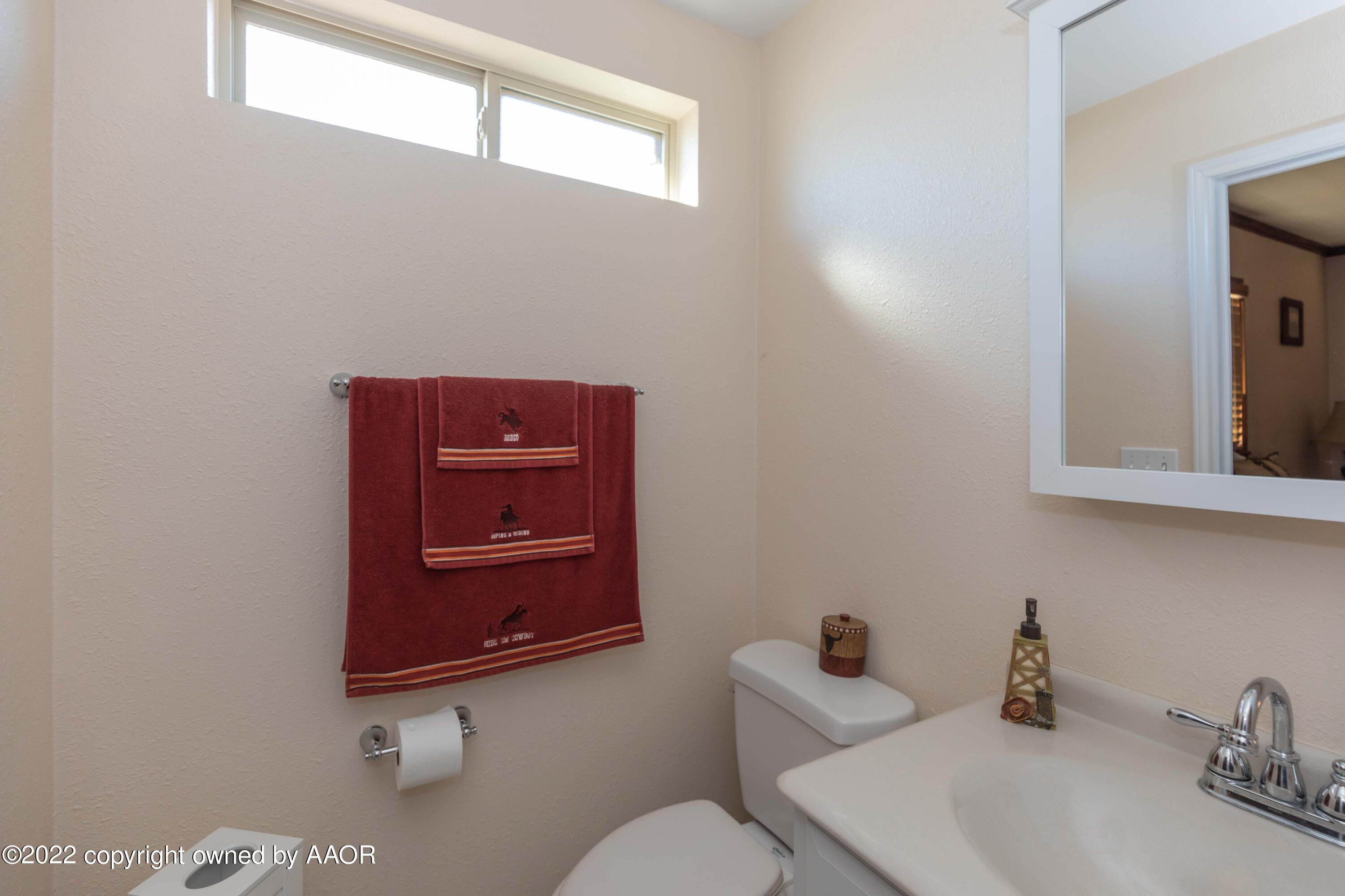 4706 South Bryan Street Amarillo, TX 79110 - Photo 27 of 40 a bathroom with a sink and a mirror