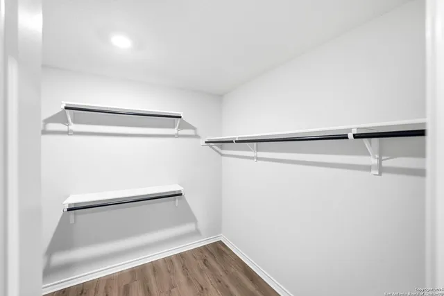 a view of an empty walk in closet