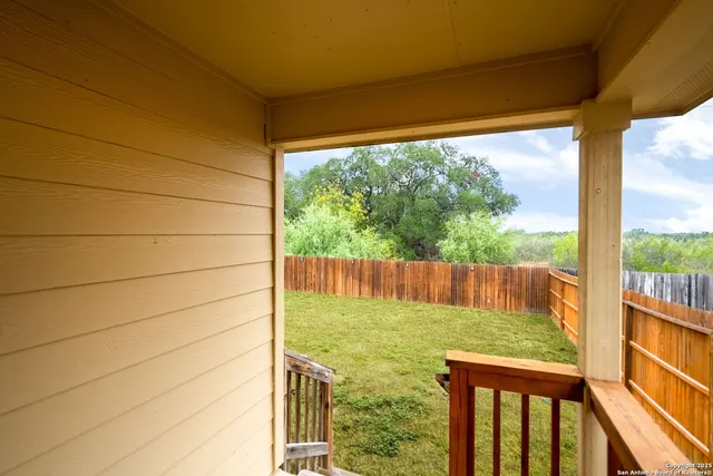 a view of balcony with yard